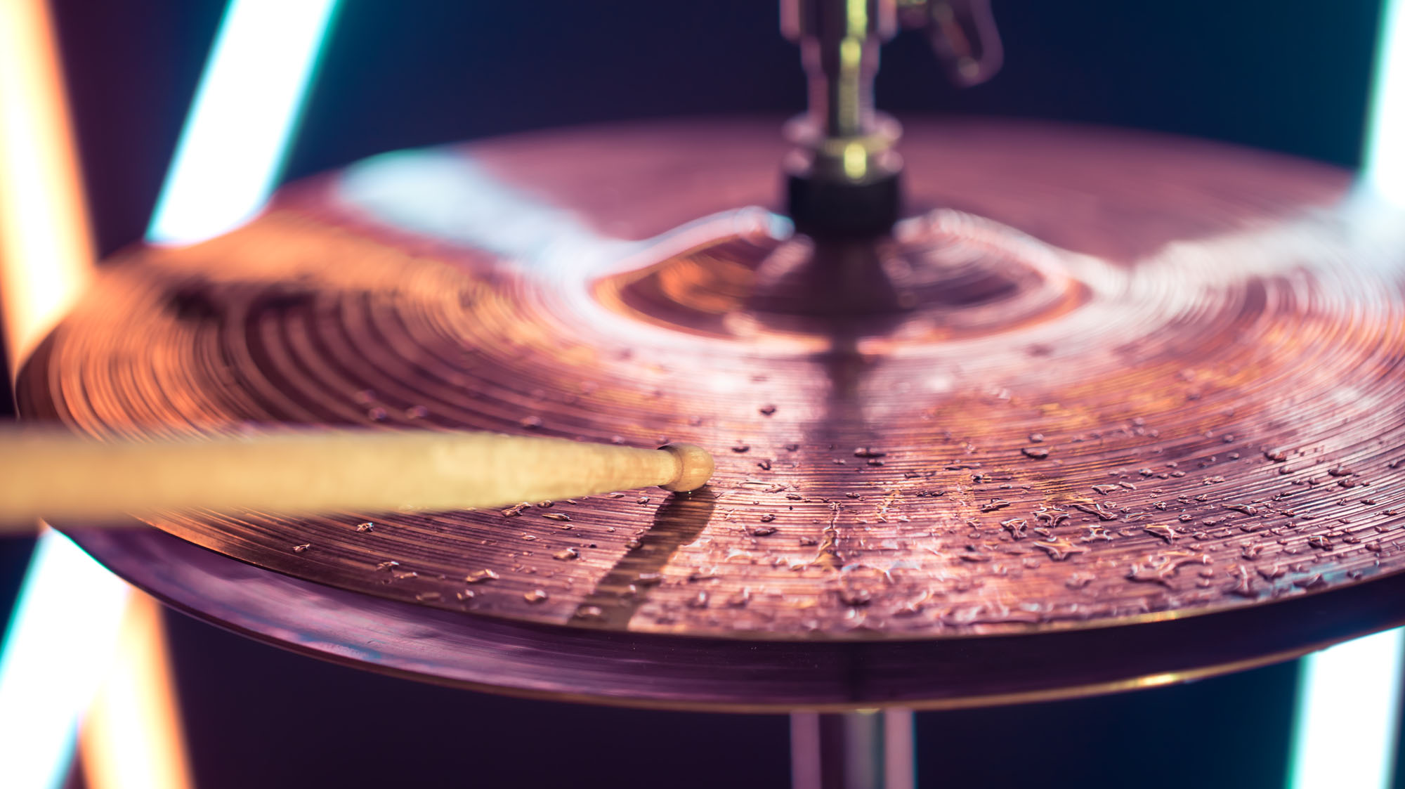 Hi-hat close-up of plates with drumsticks